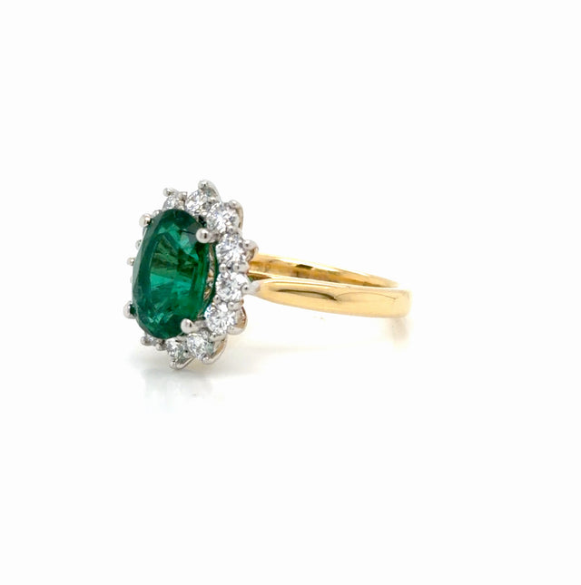 Oval Emerald and Diamond Halo Ring in Yellow Gold & Platinum