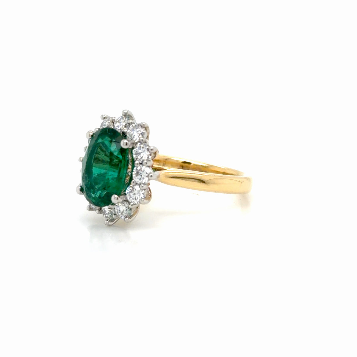 Oval Emerald and Diamond Halo Ring in Yellow Gold & Platinum
