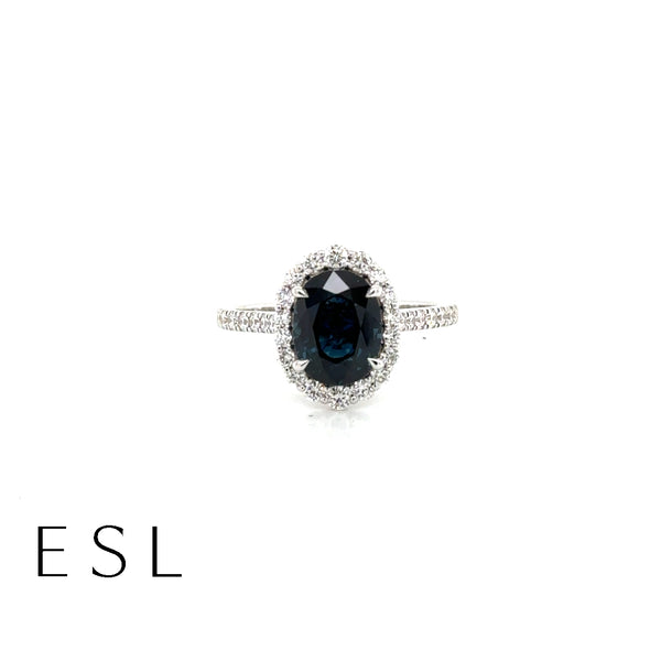 Oval Sapphire Ring With Halo Set In 18ct White Gold