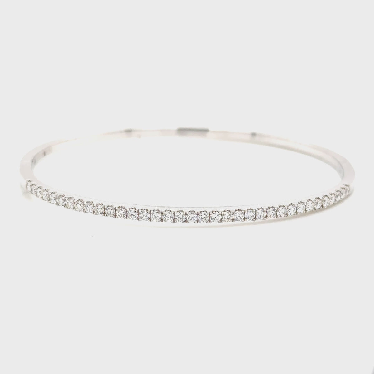 18ct White Gold Castel set Diamond hinged bangle